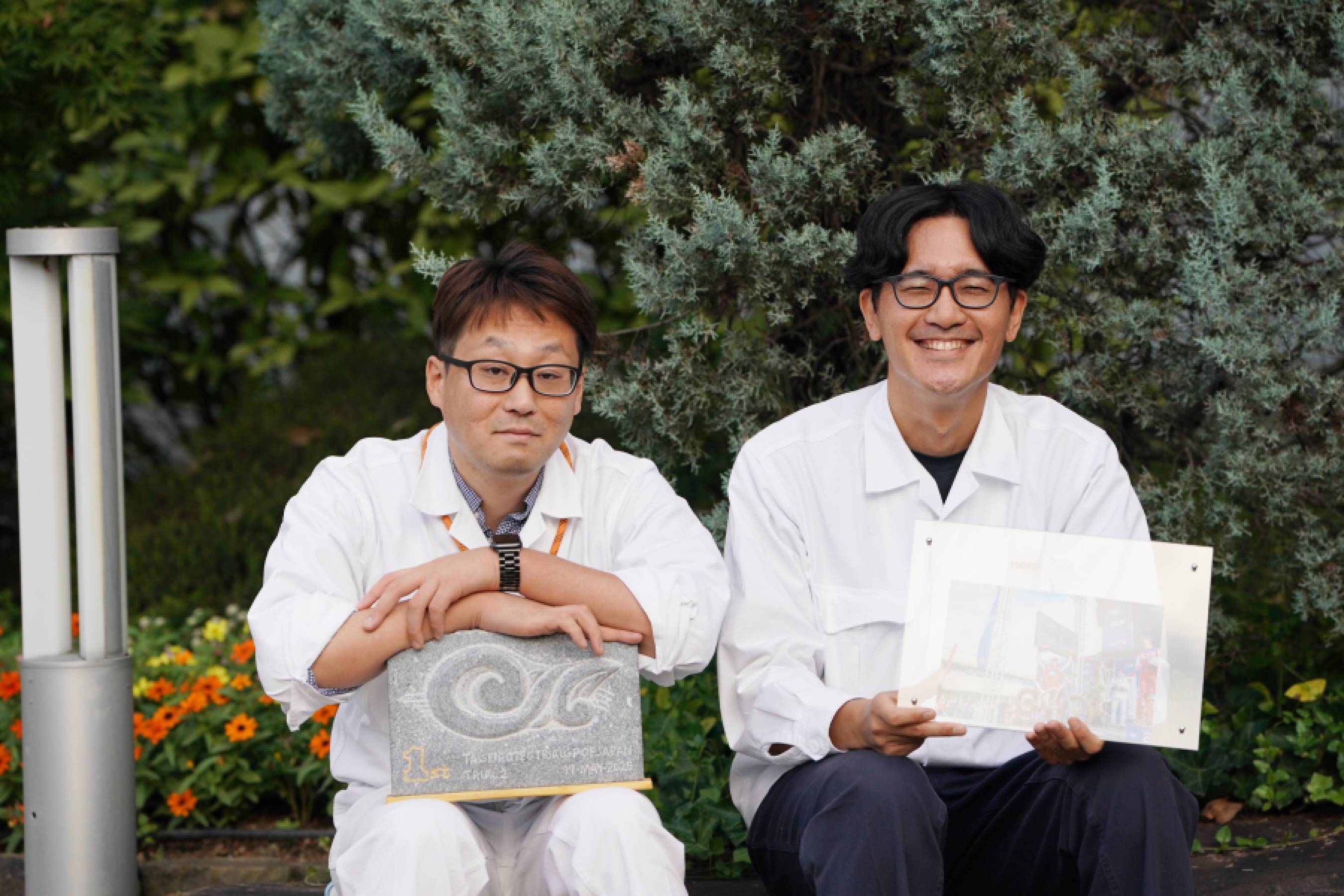 二輪・パワープロダクツ電動事業開発統括部の秋吉洋行(写真左)と深尾祐介(写真右)